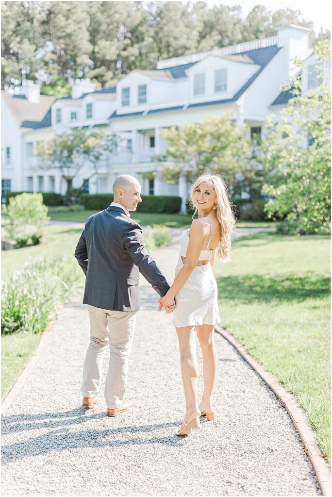 Couple walking the grounds of the Inn at Perry Cabin in St. Michaels Maryland