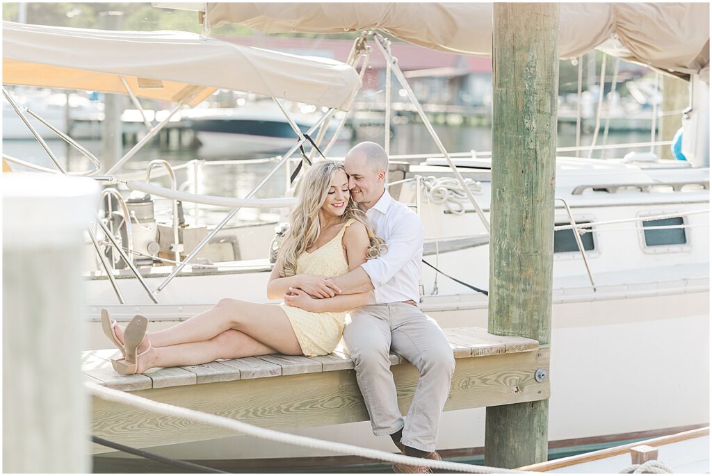 Couple posing by boats at the Chesapeake Maritime Museum