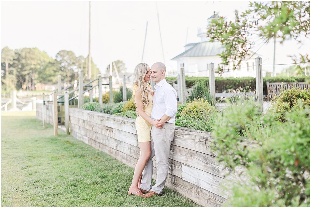 Couple posing for Maryland wedding photographer in St. Michaels, Maryland at the Chesapeake Maritime Museum