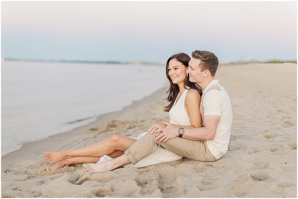 sitting in the sand on lewes beach, delaware